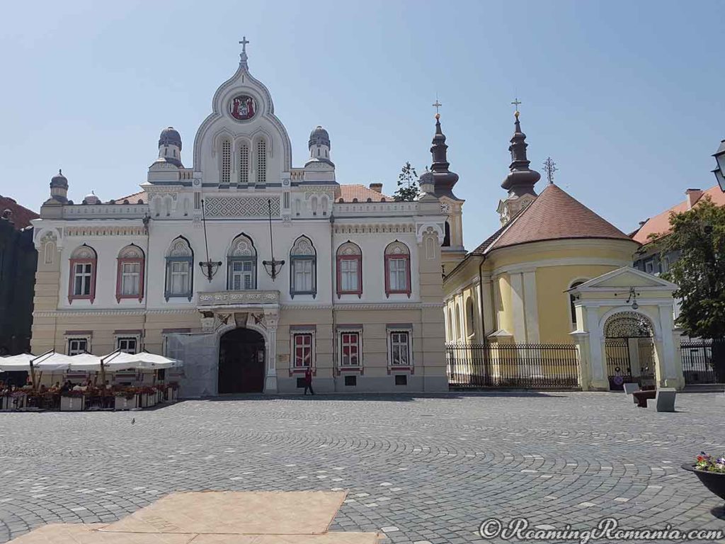 Serbian Episcopal Palace (left) in Timisoara, Romania