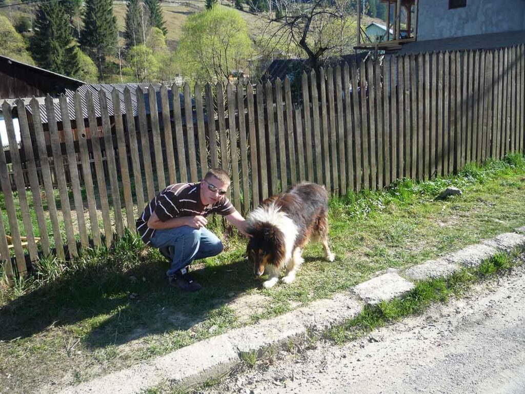 Me comforting a stray during my first trip to Romania in 2009